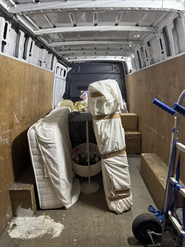 Furniture protected with wrapping inside a removal van
